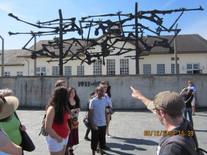 MC Study Abroad students listen to a lecture at Dachau German concentration camp (Photo Credit: Greg Malveaux).