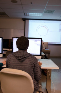 Student learning the skill for a technological course.