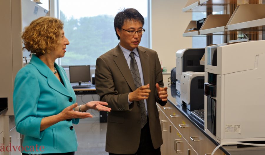 Instructional Dean for Science Engineering & Math Eun-Woo Chang explains the latest technology available at the new Montgomery College science center to college Vice President Judy Ackerman. -- Photo by: Stephen Weigel