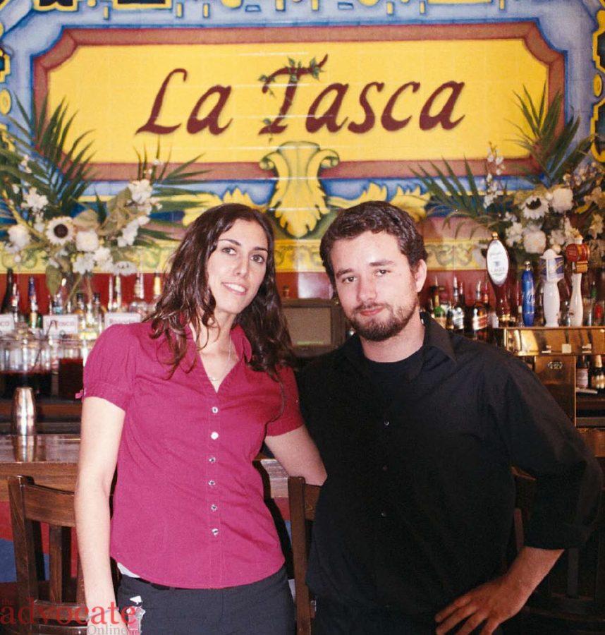 Mariana Pisciottano and Geoffrey Lemoir stand in front of the bar inside La Tasca. -- Photo by: Shelli Block