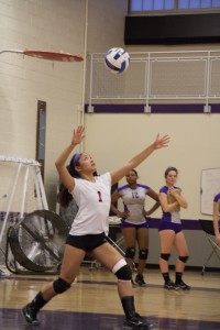 Freshman Christy Mempin, 1, serves the ball. (Photo Credit: Adriano Cassoma)