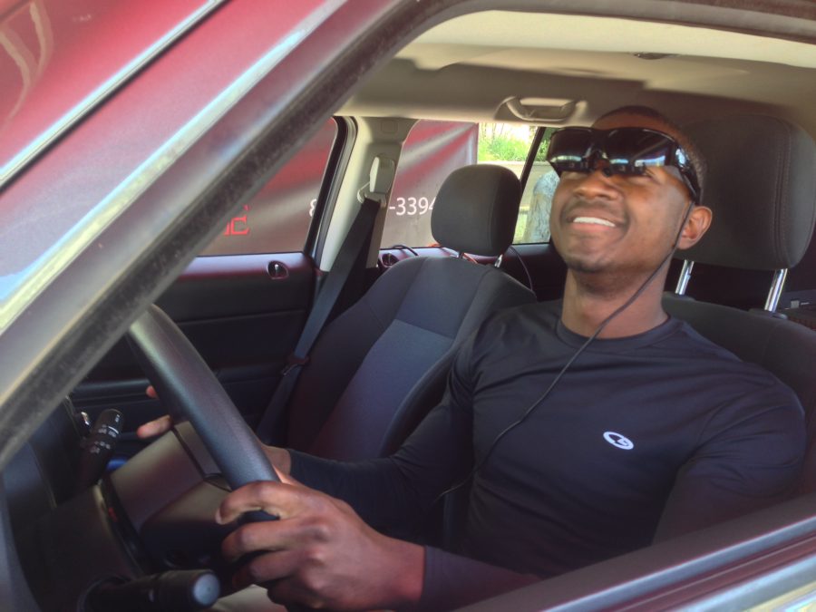 Devaughn Page goes through the simulator, experiencing effects of driving under the influence. (Photo Credit: Adriano Cassoma)