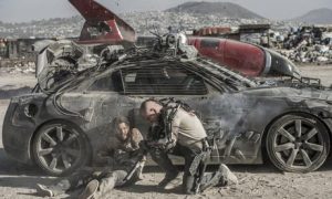 Diego Luna (left) and Matt Damon on the remains of Earth in Elysium (Photo Credit: The Guardian)