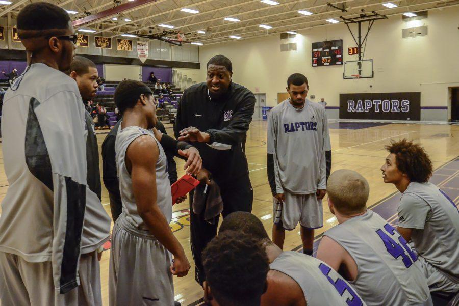 Head Coach James Bryson instructs his team during a timeout.