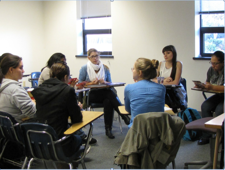 The Women’s Studies Club gather in HU 122 to discuss key points to the beginning of their petition In photo: Emily Christian, Becky Rosansky, Sara Black, Audrey Nankobago, Rima Sakhawala (Vice-President), Alexandra Weidt (President), Tatiana Mendez, Wanda Salcedo (Treasurer) (Photo credit: Ejig Diriba)