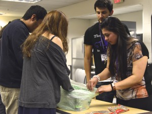 Student assistants Adrian Vermaaten and Yansi May, supervise volunteers.