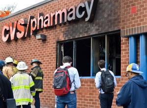 Protesters and Local Fire Department in Front Burnt Down CVS Store