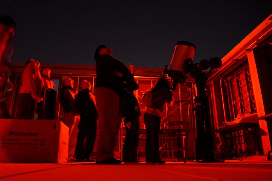 Stargazers look through the colleges professional telescope on top of the Science Center. Photo Credit: Josue Arce