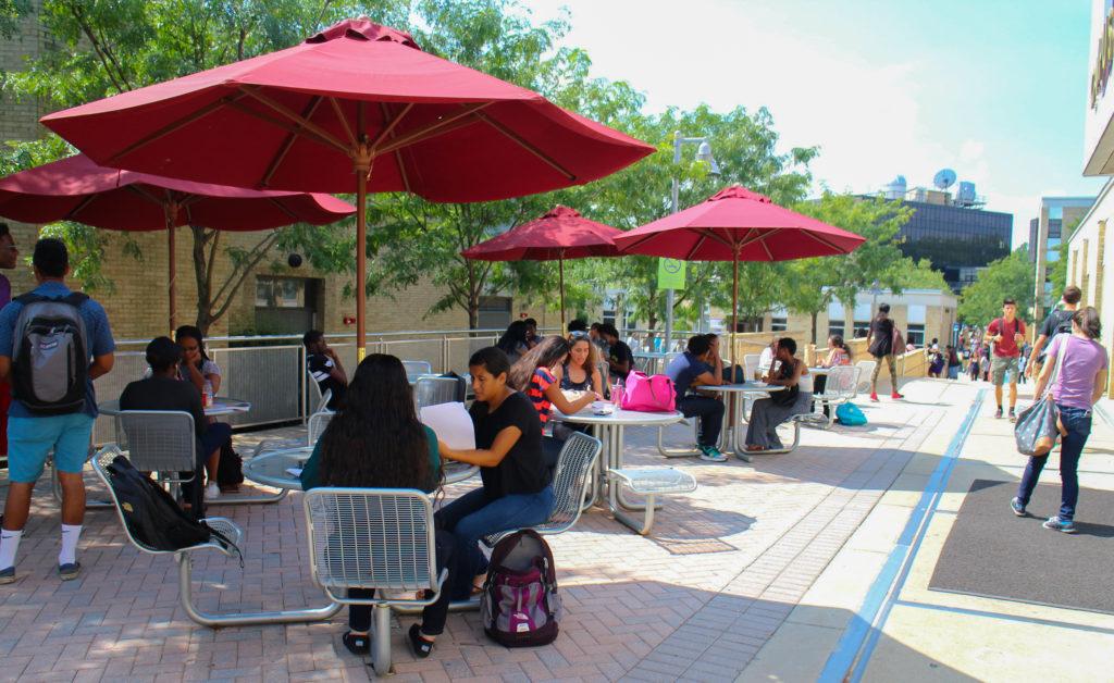 Students sitting at MC's outdoor seating located outside of the Campus Center (photo: Enori Atsu)