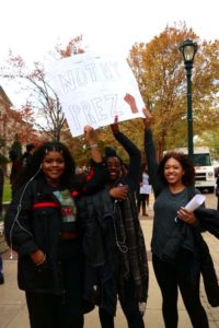 Three female students at the RM walk-out 