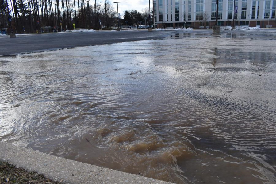 Water flowing over parking lot 11 on Jan. 25.