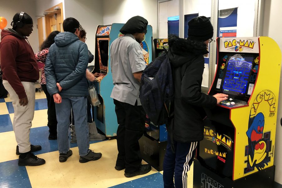 Students play classic arcade games at MC Raptor Week