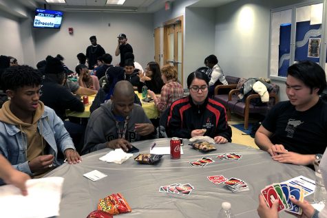 Students playing Uno at MC Raptor Week