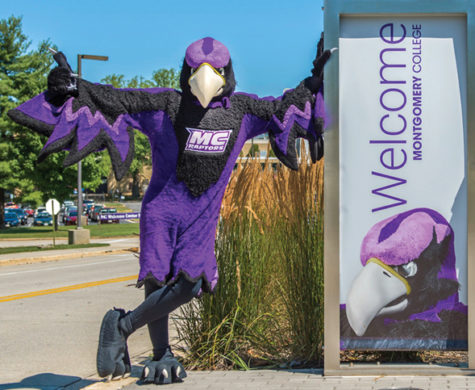 Montgomery College mascot, Montgomery C. Raptor, a.k.a. Monty, at the Rockville Campus welcome sign. Photo by Pete Vidal. Source: http://mcblogs.montgomerycollege.edu/insights/2019/01/11/meet-montgomery-c-raptor-aka-monty/