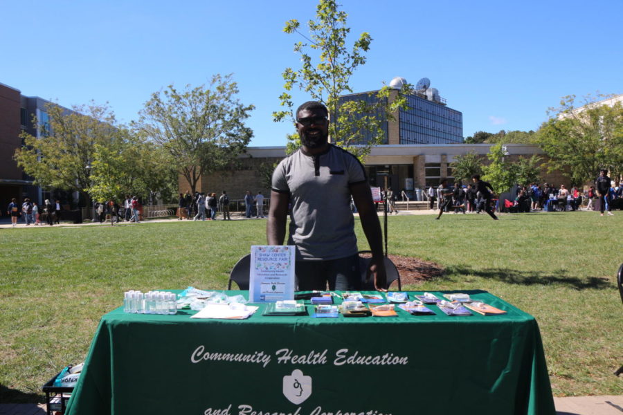 Dr. Chiangeh poses behind the CHERC table during Club Rush. 