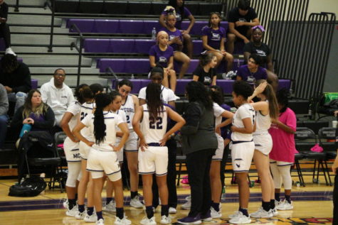The Montgomery college womens basket ball team on time out.