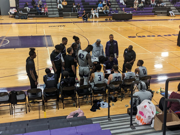 Montgomery College mens basketball team huddling up during a time out