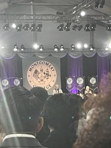 Picture of President Jermaine F. Williams on stage making a speech. Photo Credit: Angel Nyambio
