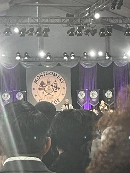 Picture of President Jermaine F. Williams on stage making a speech. Photo Credit: Angel Nyambio