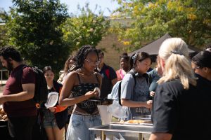Students being served food. (Photo Credits: Yabez Jackson)